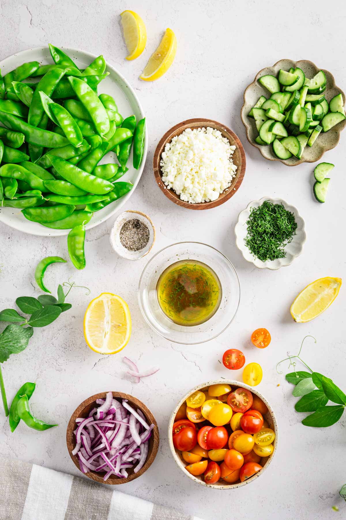 small bowl with made dressing; other salad ingredients around