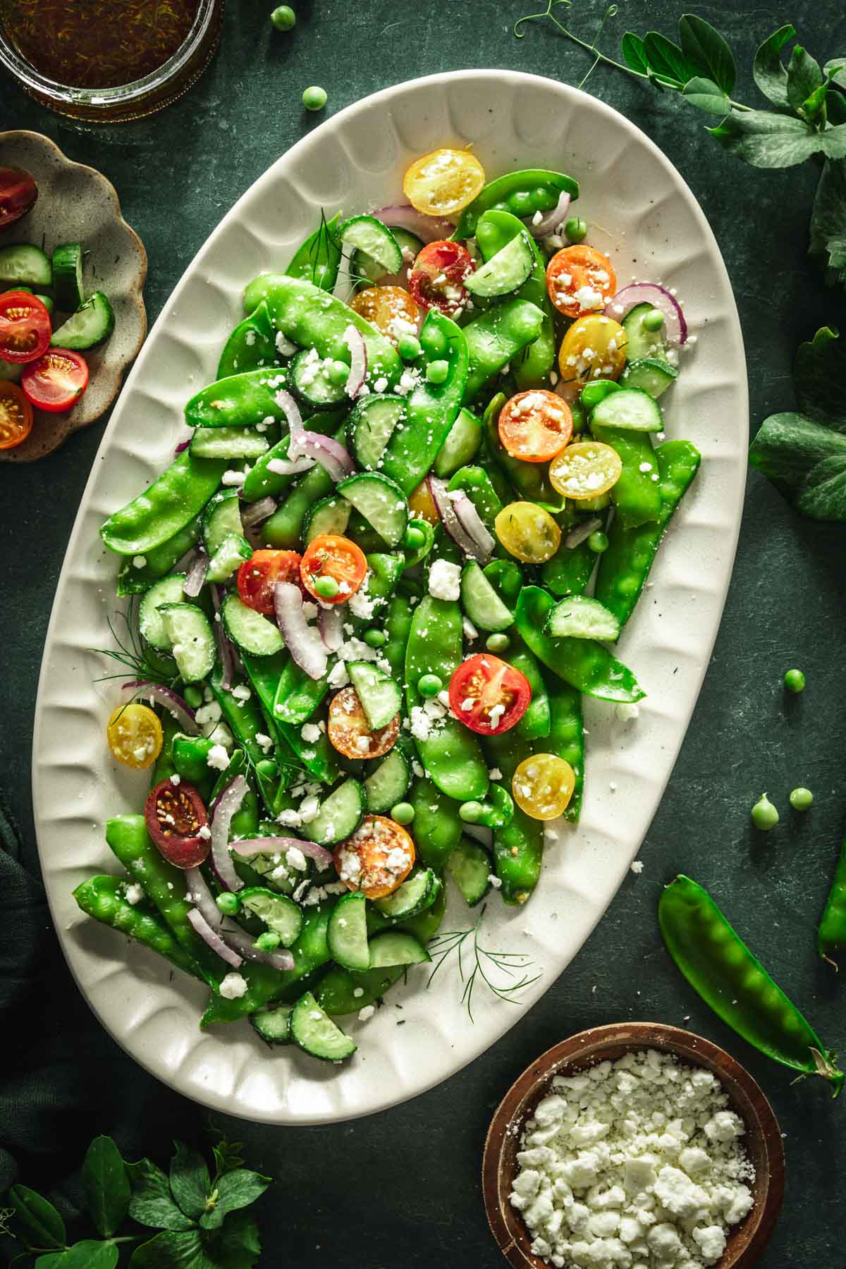 snow pea salad on a serving platter, close up