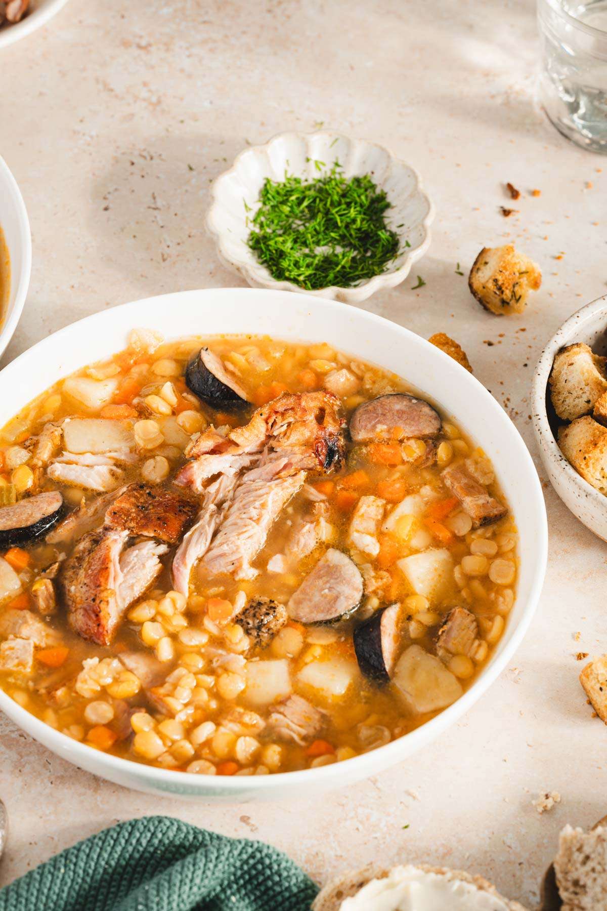 split pea soup in a serving bowl, side view