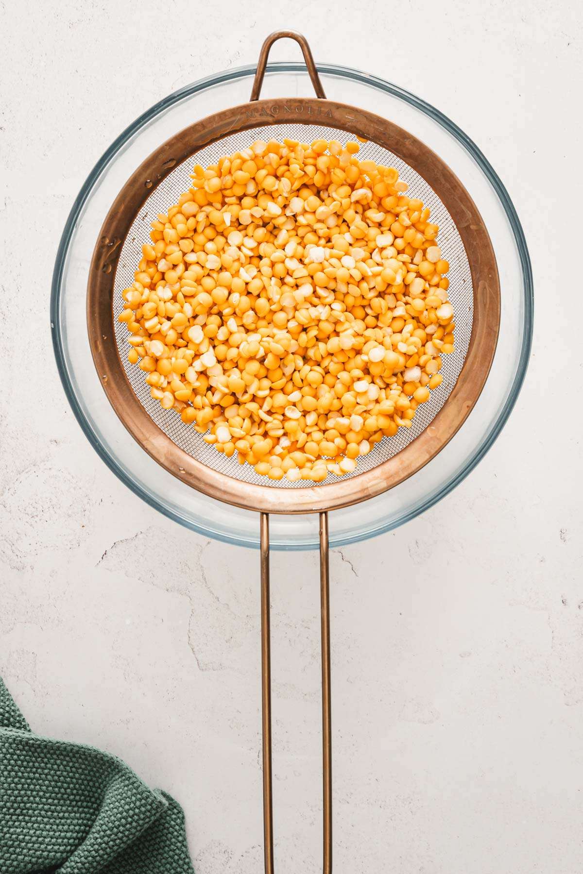 split peas in a strainer