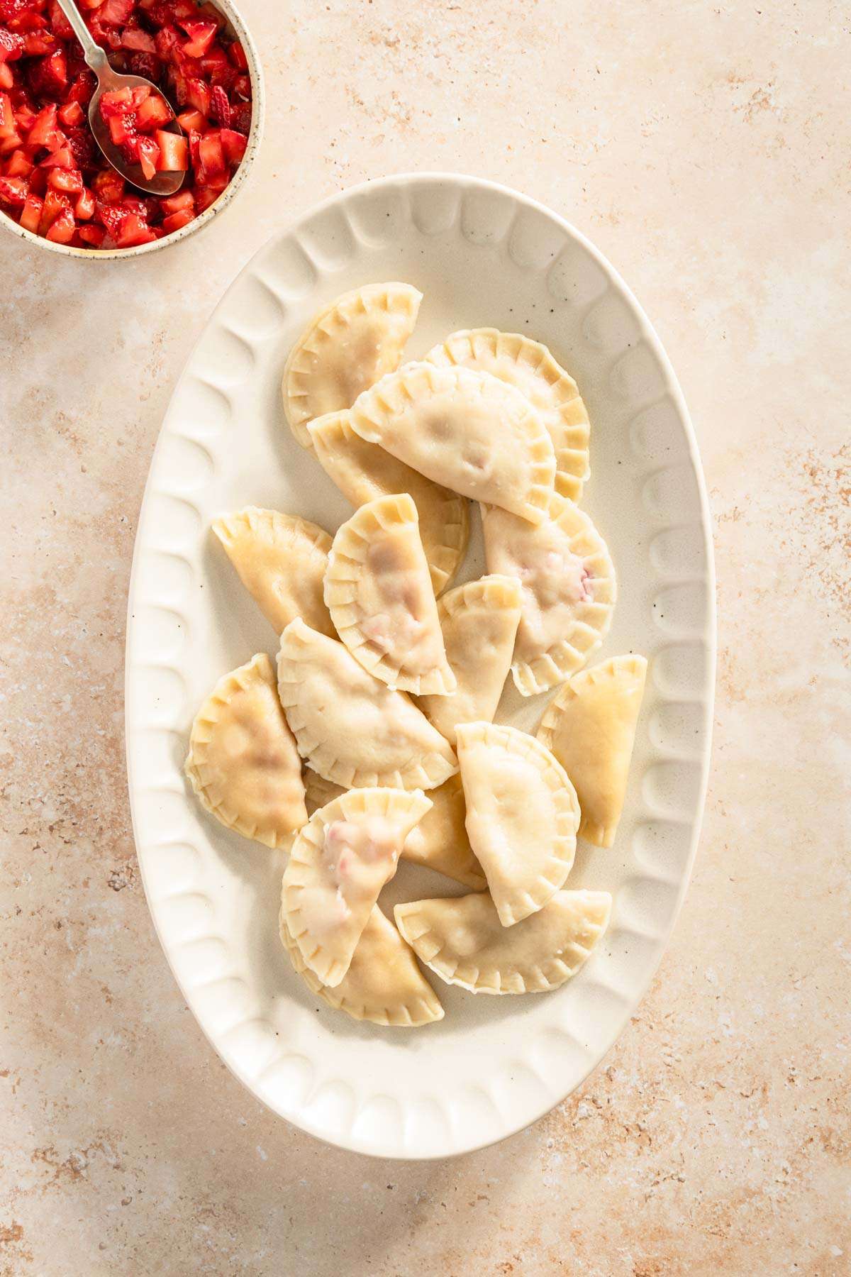 cooked pierogis on a serving platter