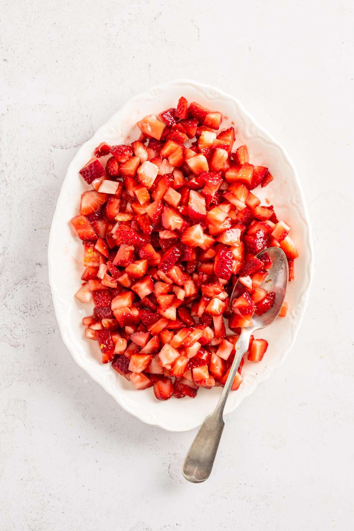 platter with cup up strawberries