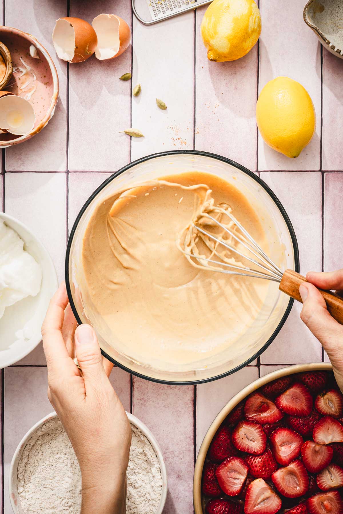 hands in frame whisking wet batter
