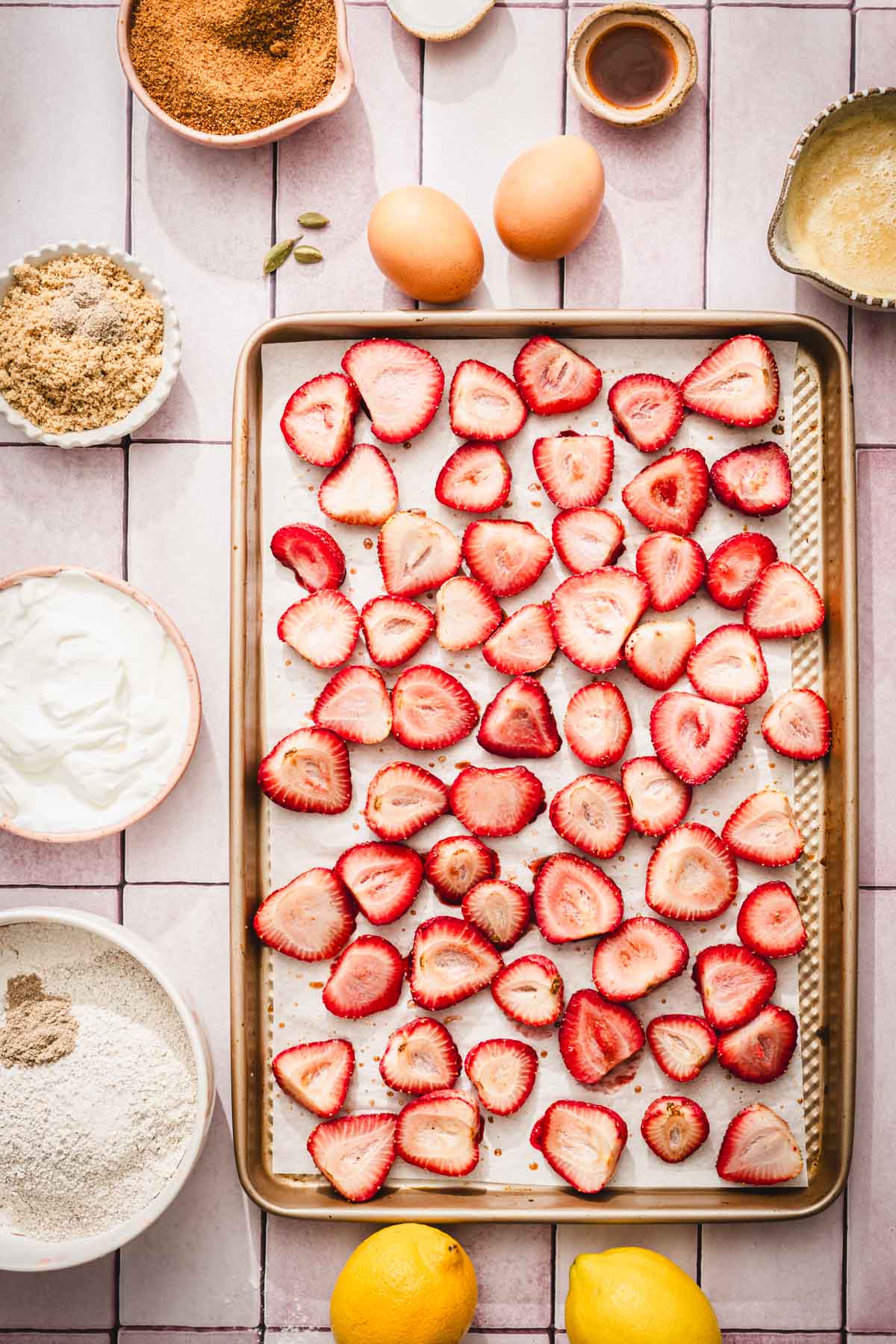 sheet pan with haleved strawberries, roasted