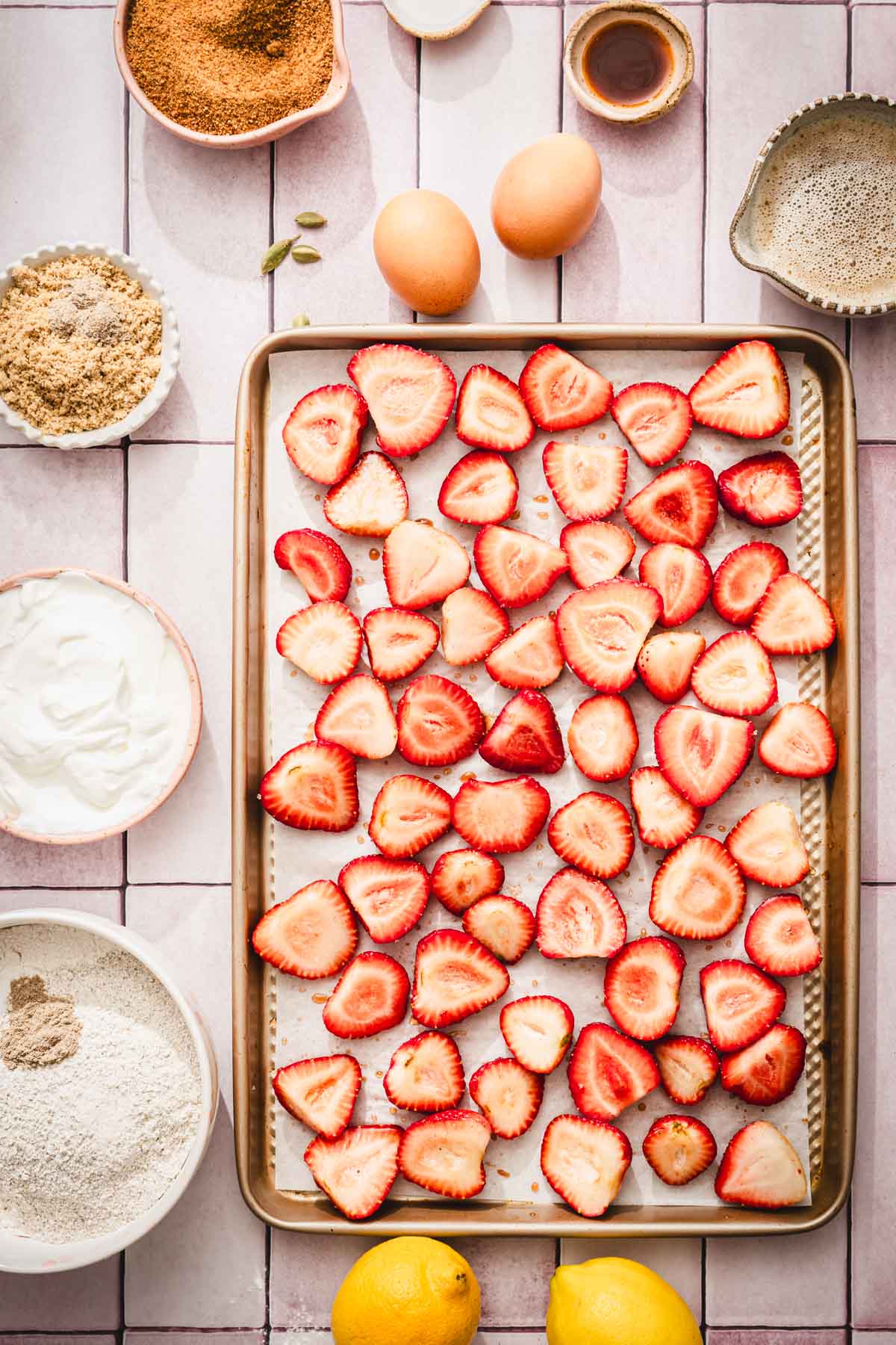 sheet pan with haleved strawberries