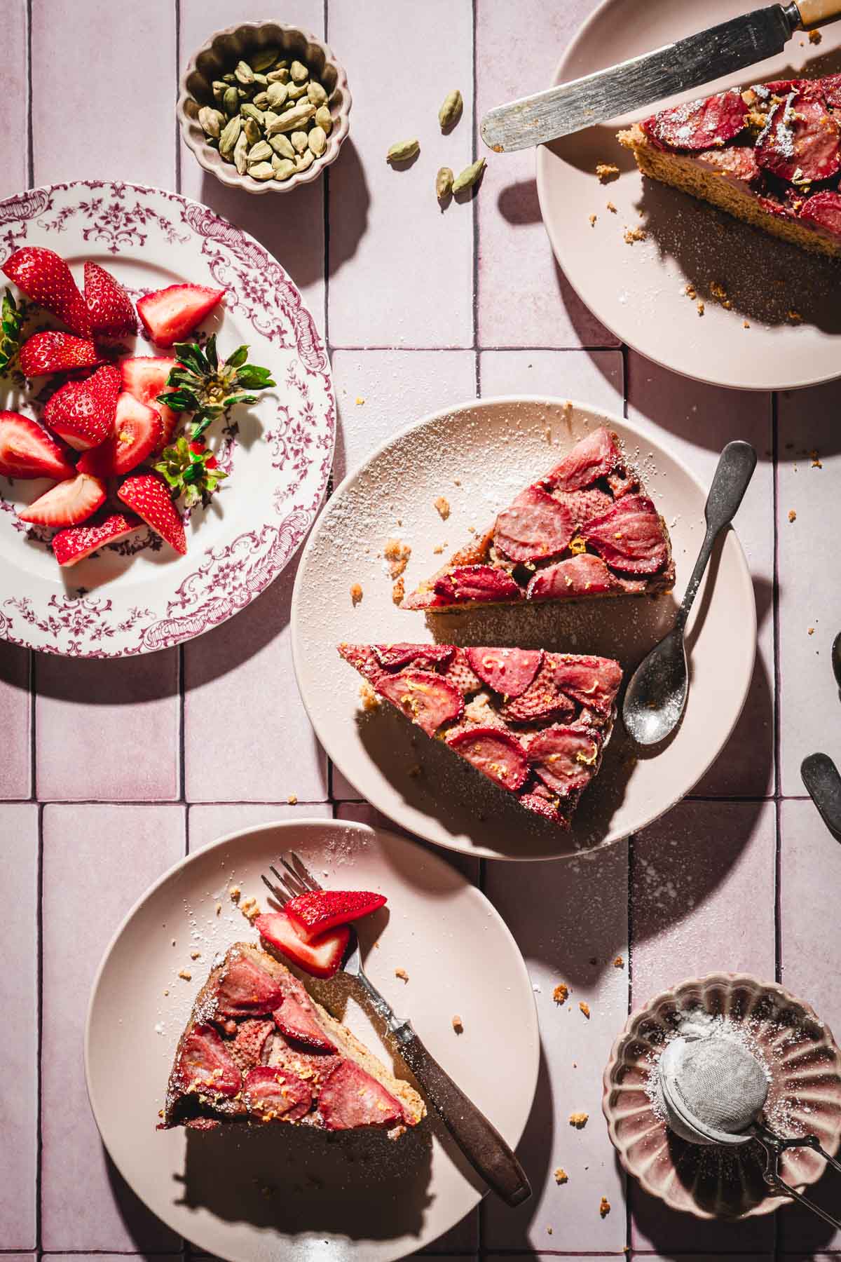 various serving plates on pink backdrop