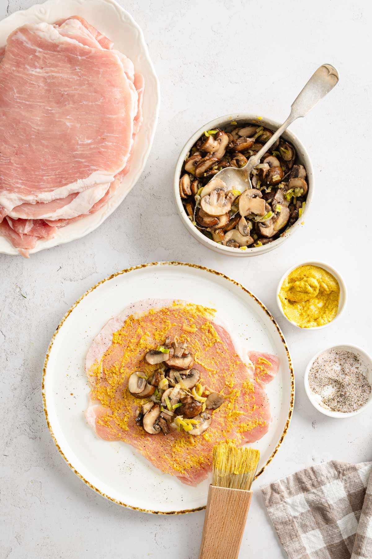 raw pork chop with added mushroom stuffing