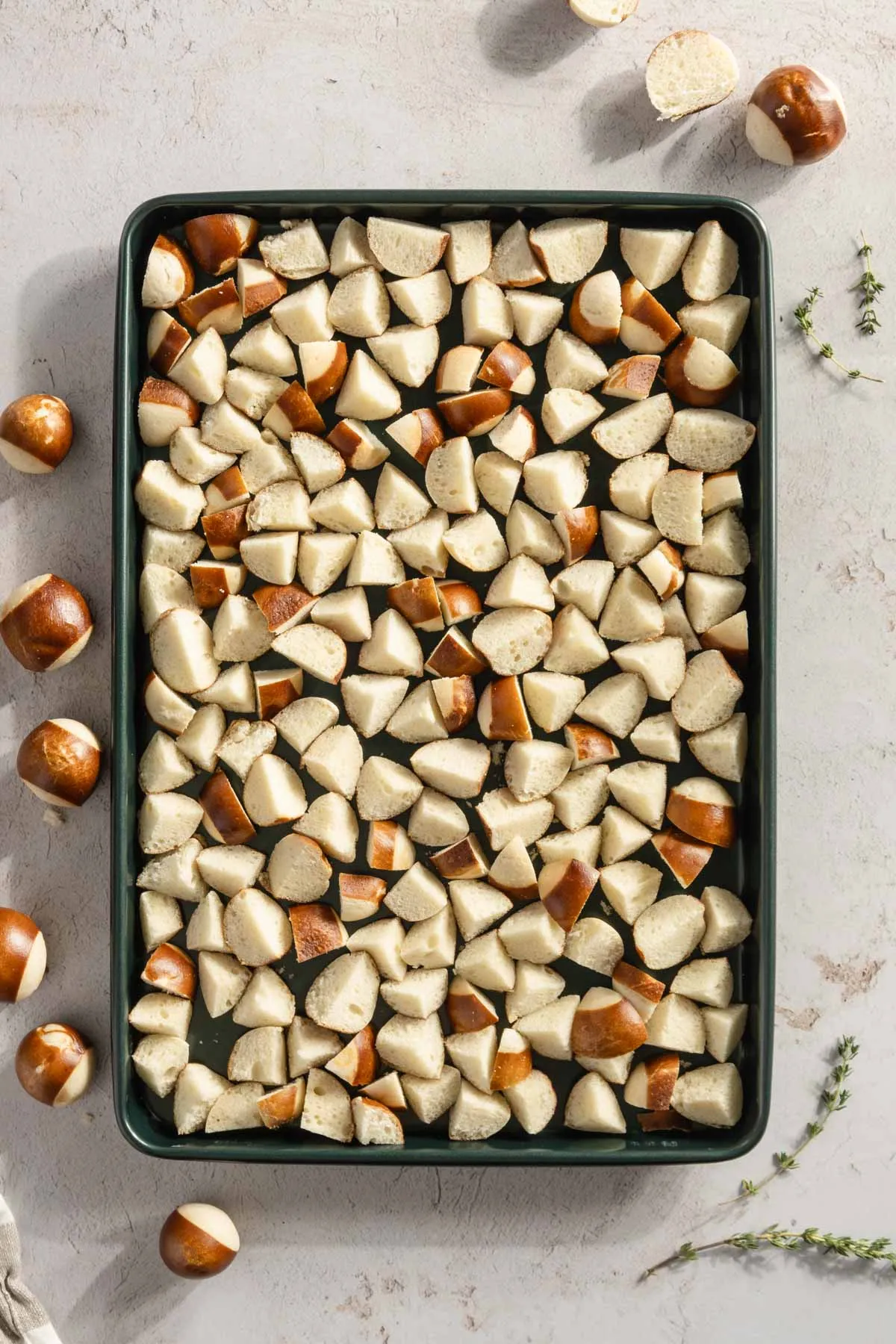 pretzels cut into small bites, on a baking sheet
