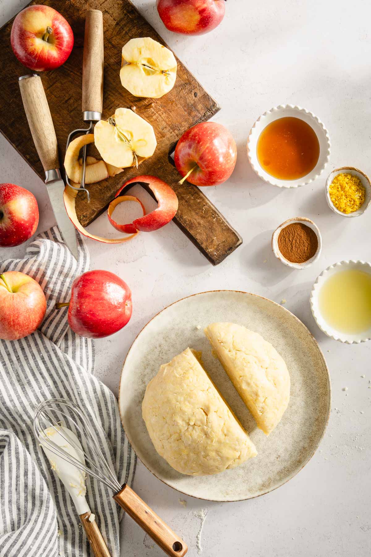 Ingredients to make Szarlotka, dough cut into two pieces