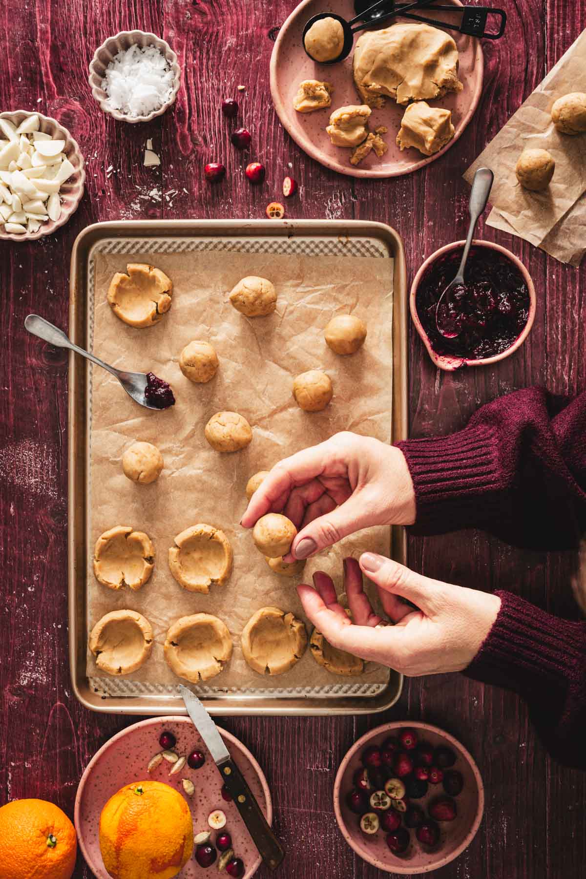 hands in frame holding a cookie dough bowl