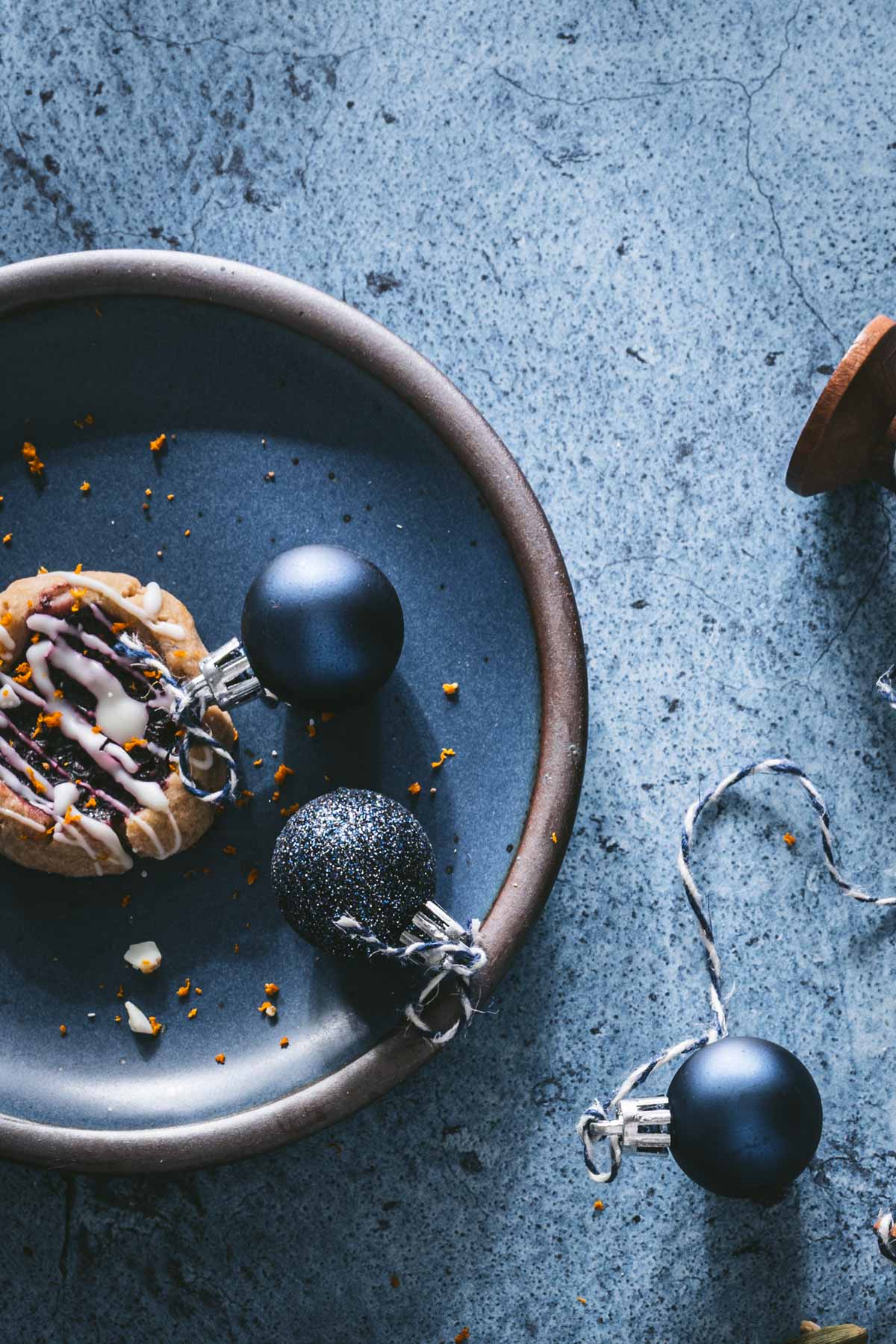 close up of plate with cookie and christmas ornament