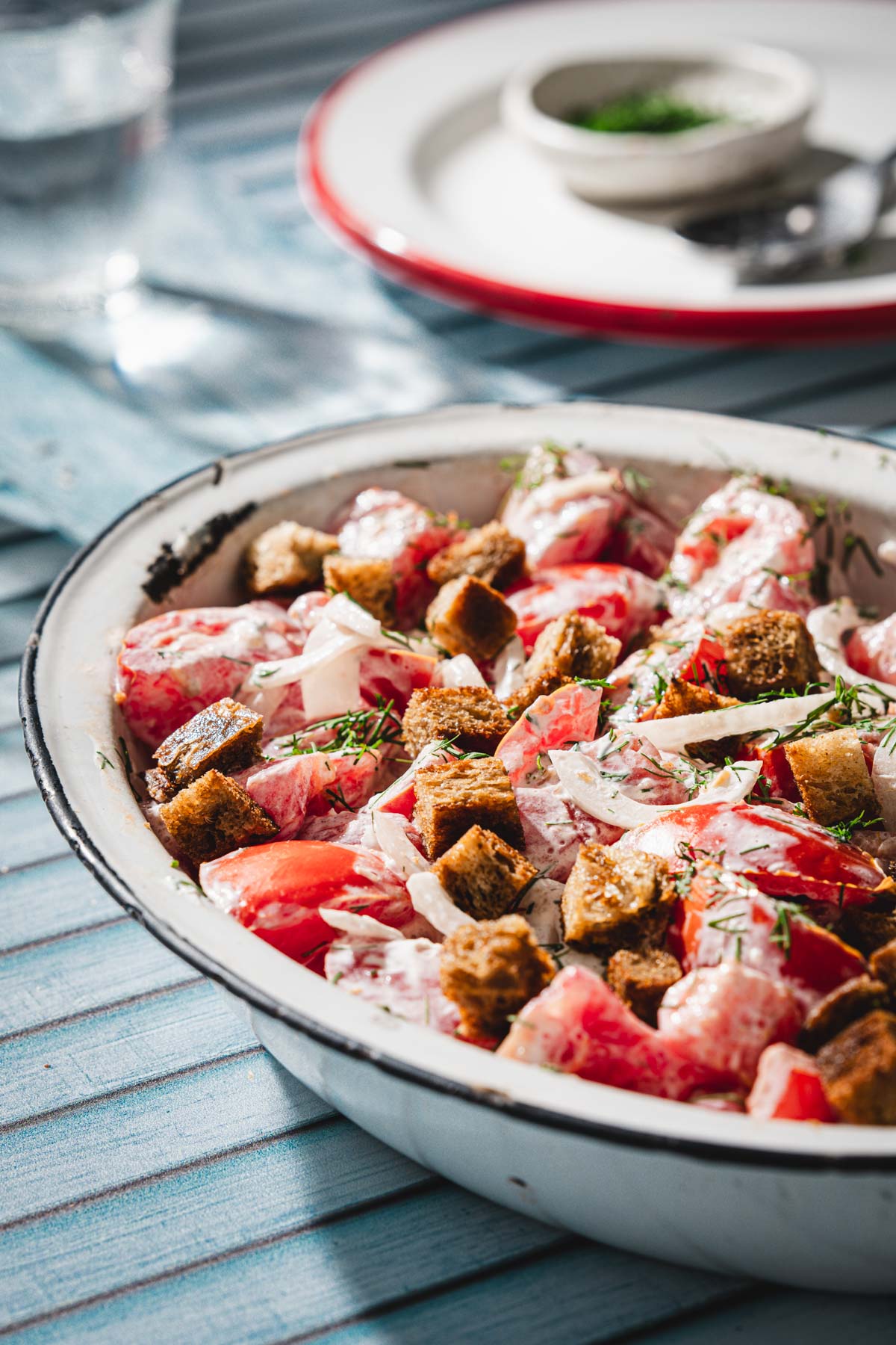 tomato salad in a serving dish, side view