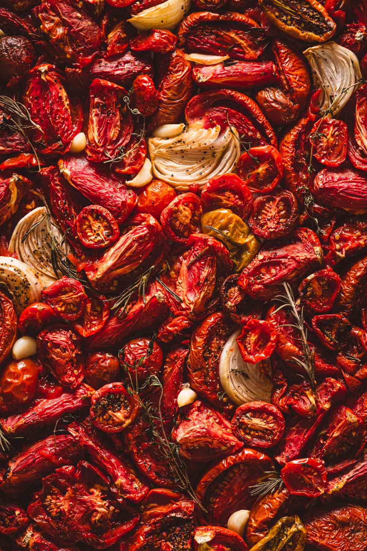 close up of roasted tomatoes on abaking sheet
