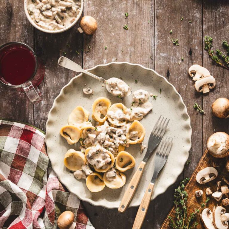 uszka on a plate served with mushroom sauce