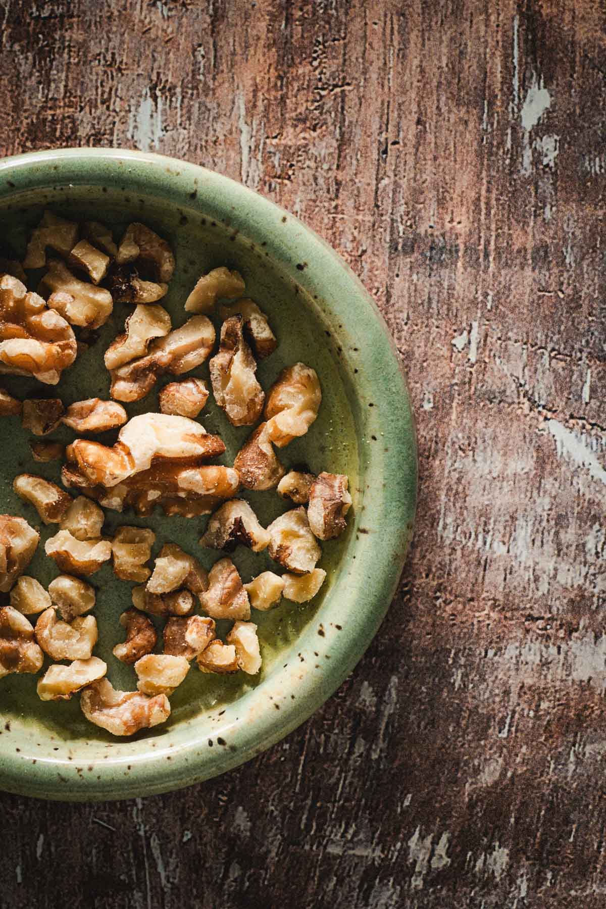 small dish with chopped walunuts