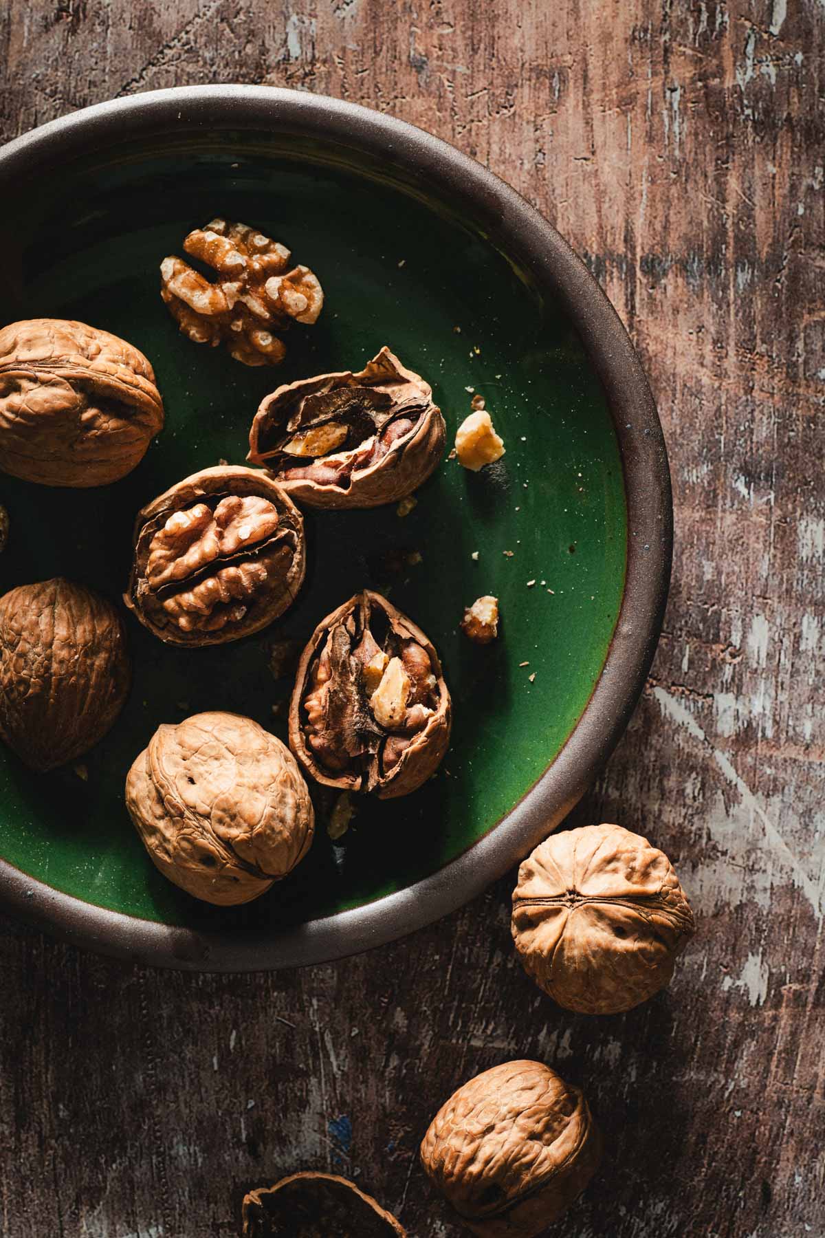 green plate with walnuts