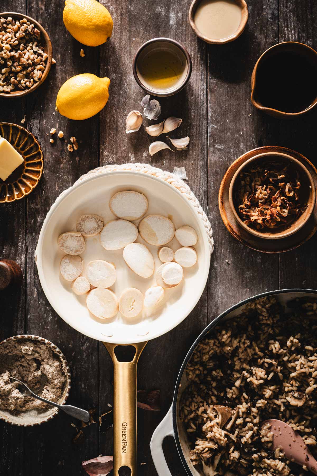 skillet with sliced king trunpet mushrooms