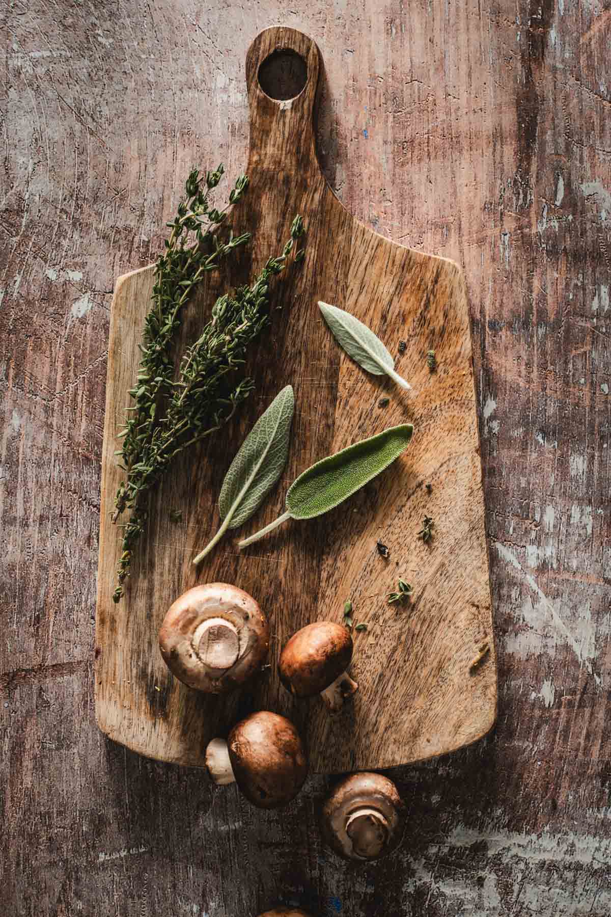 wooden board with fresh herbs