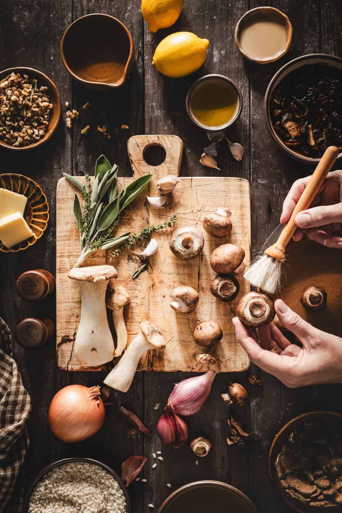 hands in frame cleaning mushooms