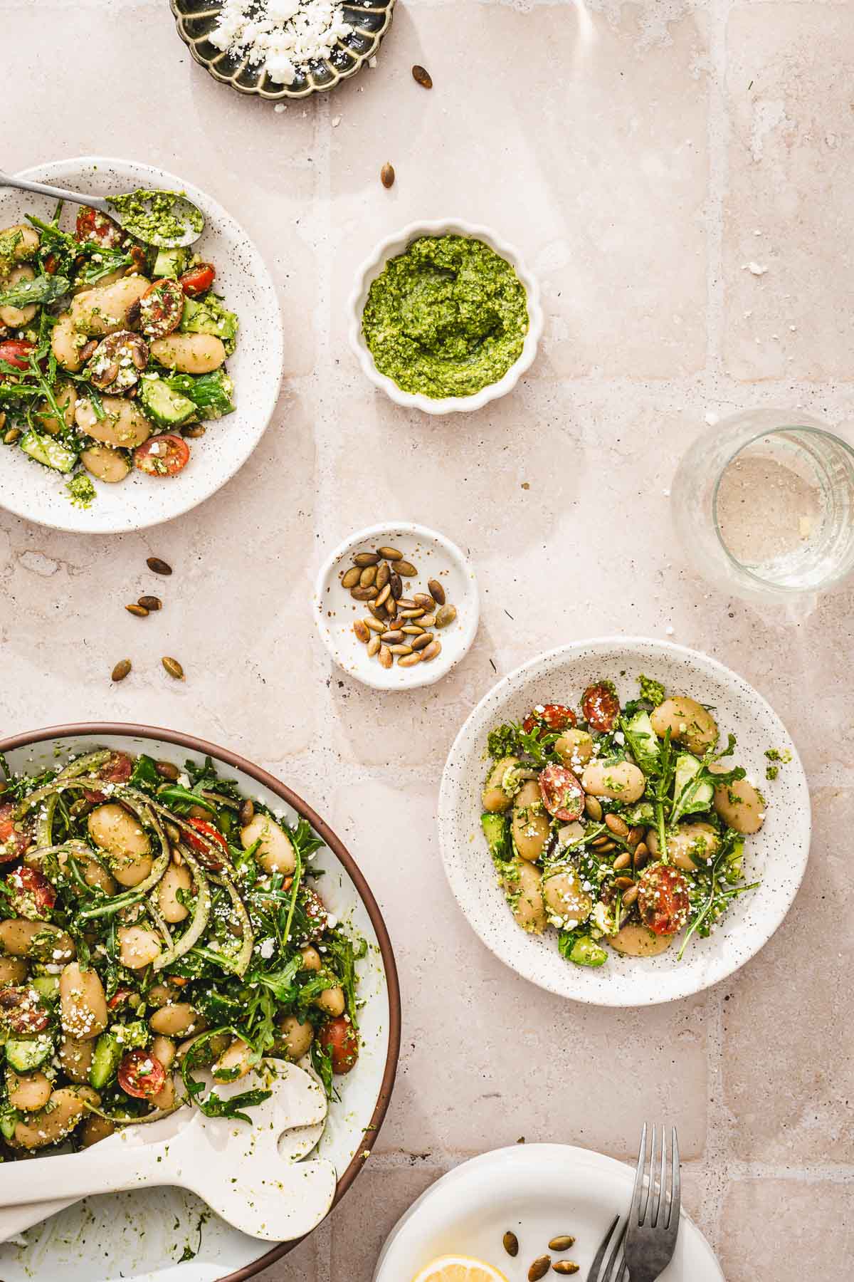 plates and bowls with the salad, glasses with water