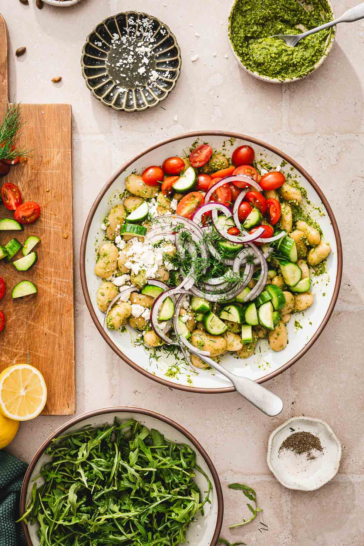 onions, tomatoes,cucumbers, feta added to the bowl with beans