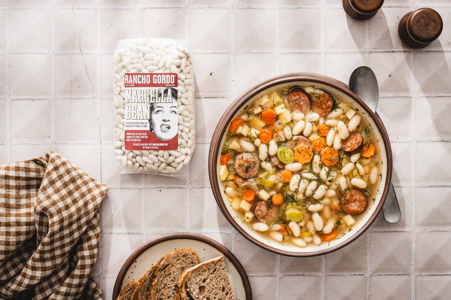 bowl with the soup, package with dry beans to the left
