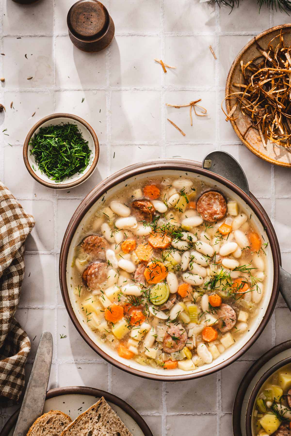 bowl with the white bean soup, gresh dill