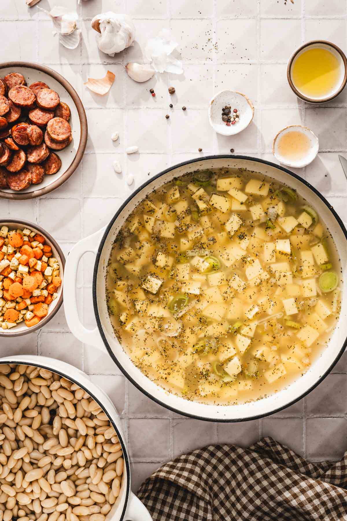 pan with broth and potatoes added