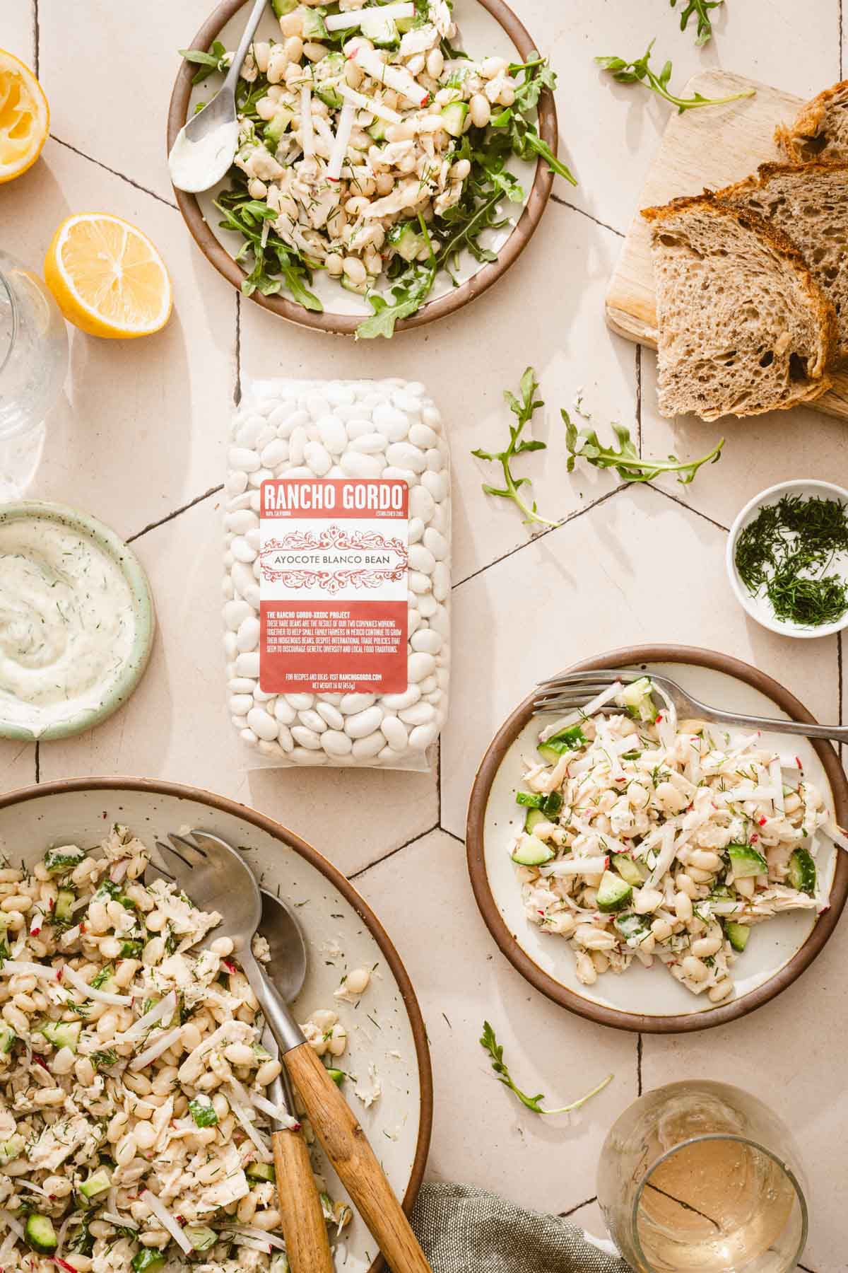 bag with dry beans, plates with the bean tuna salad