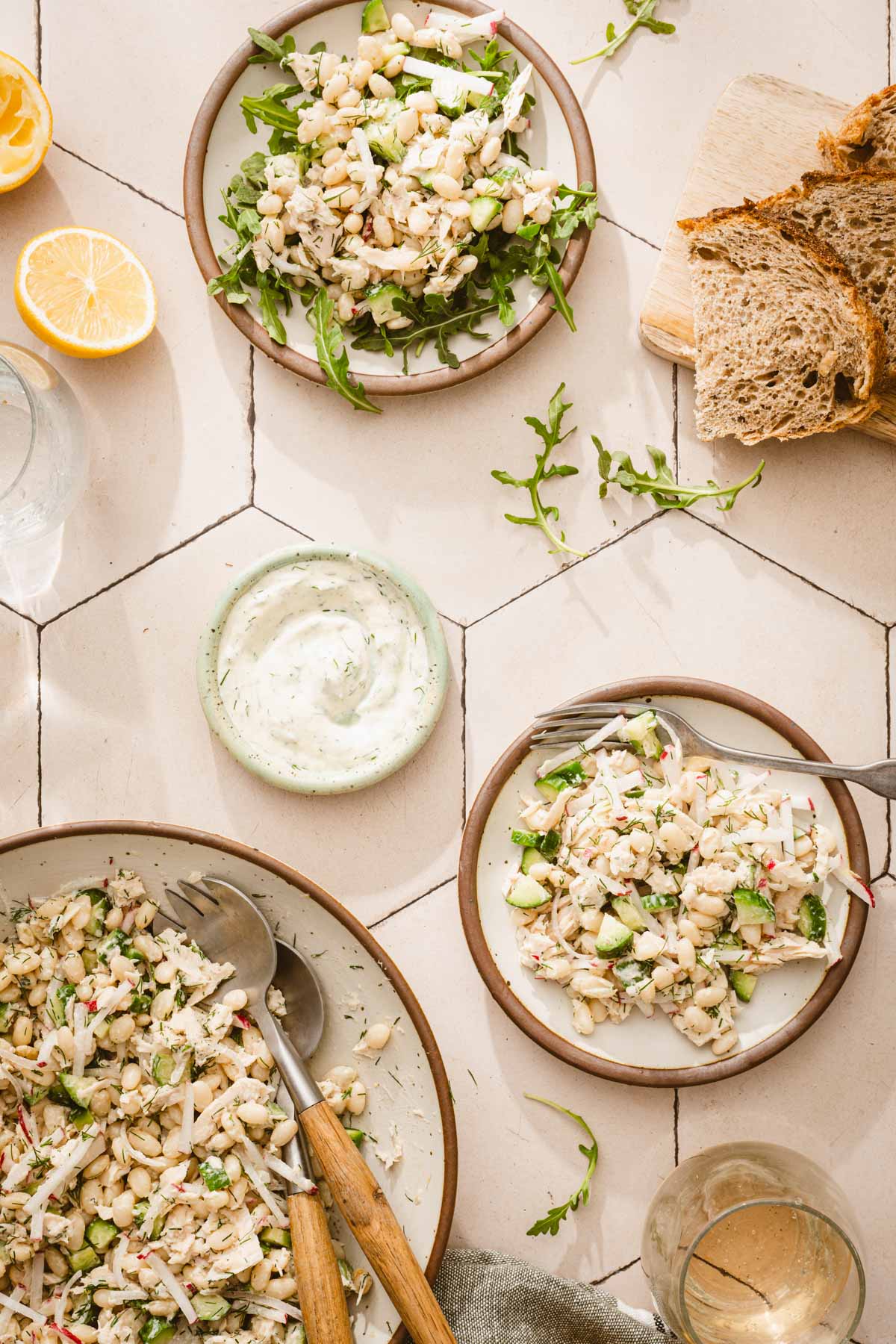 various plates with the salad, slices of bread