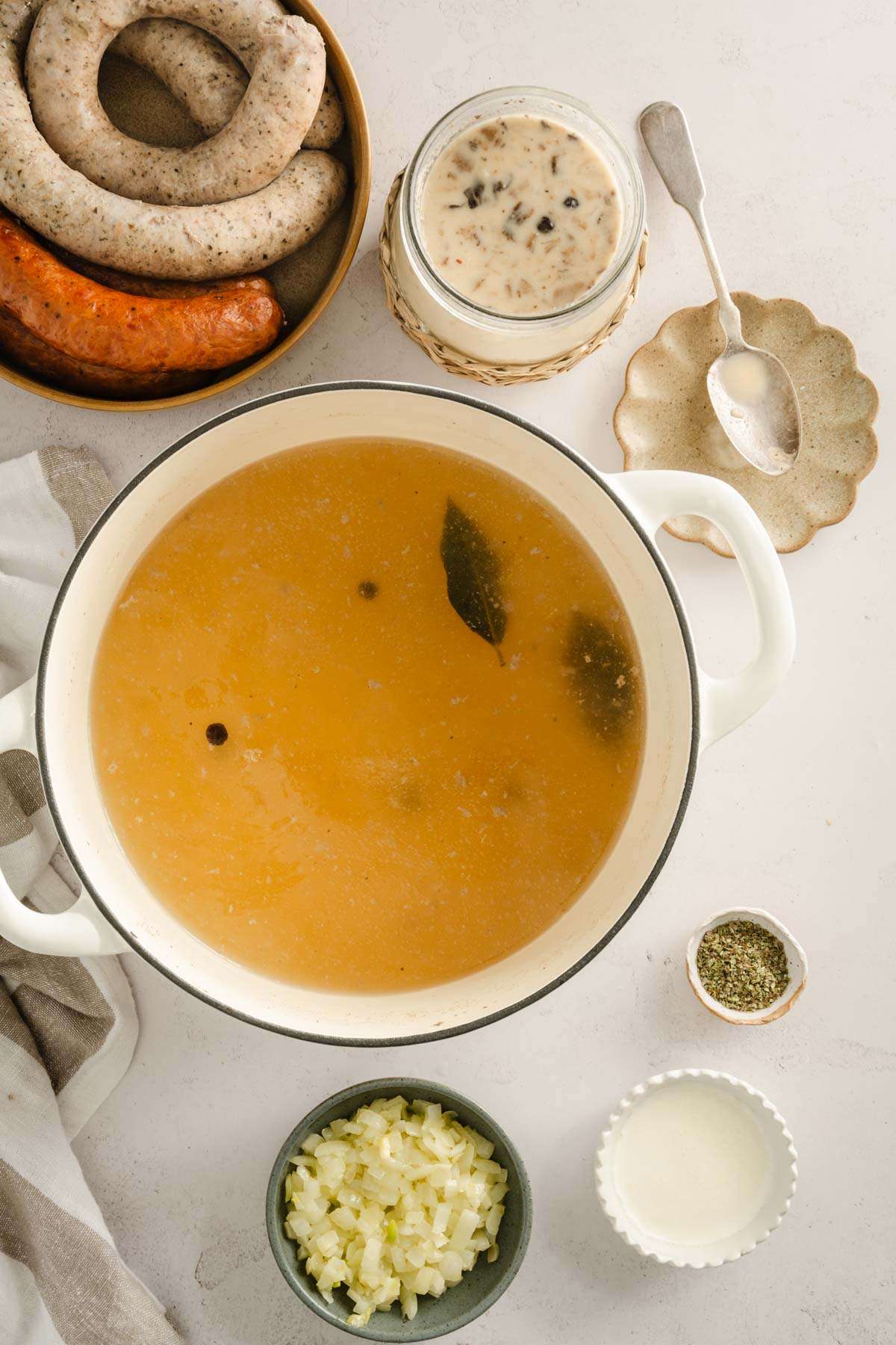 stock pot with broth, other ingredients to make Zurek set around it