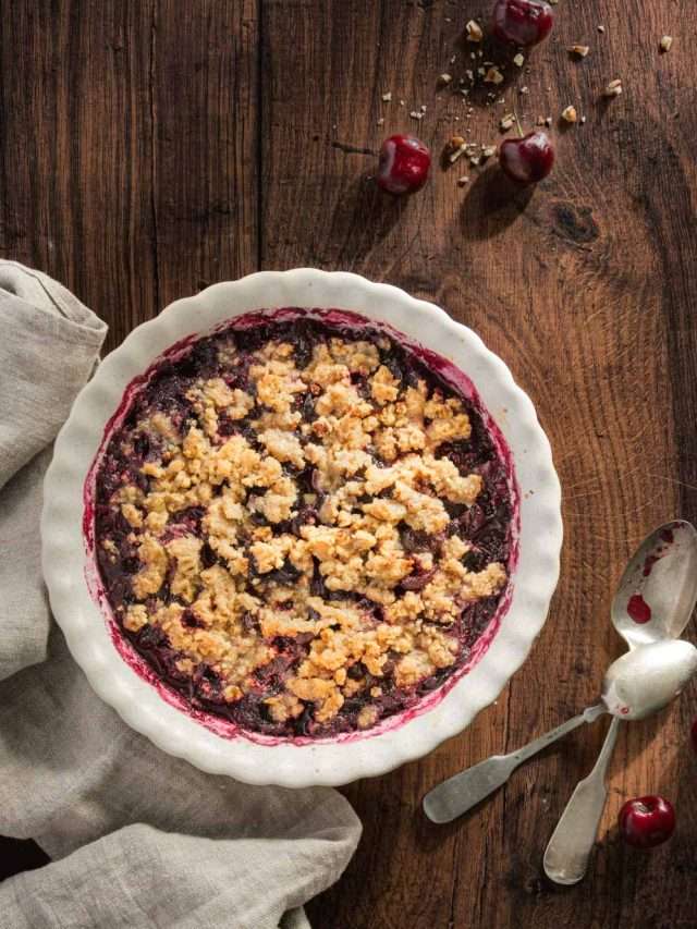 baked cherry crisp shown in a serving dish