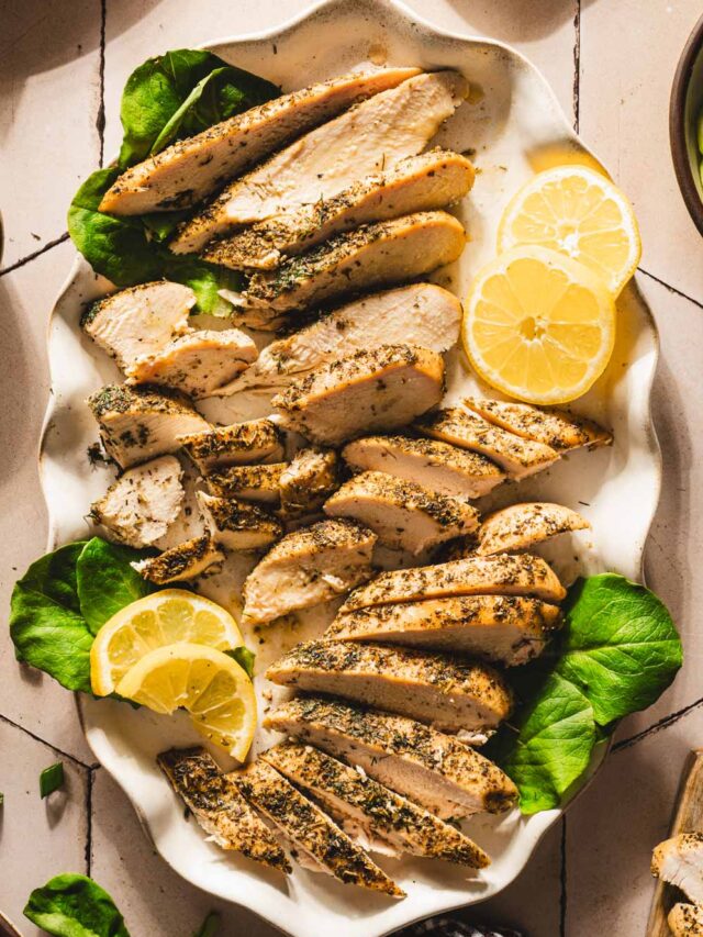 sliced chicken breasts on a serving platter