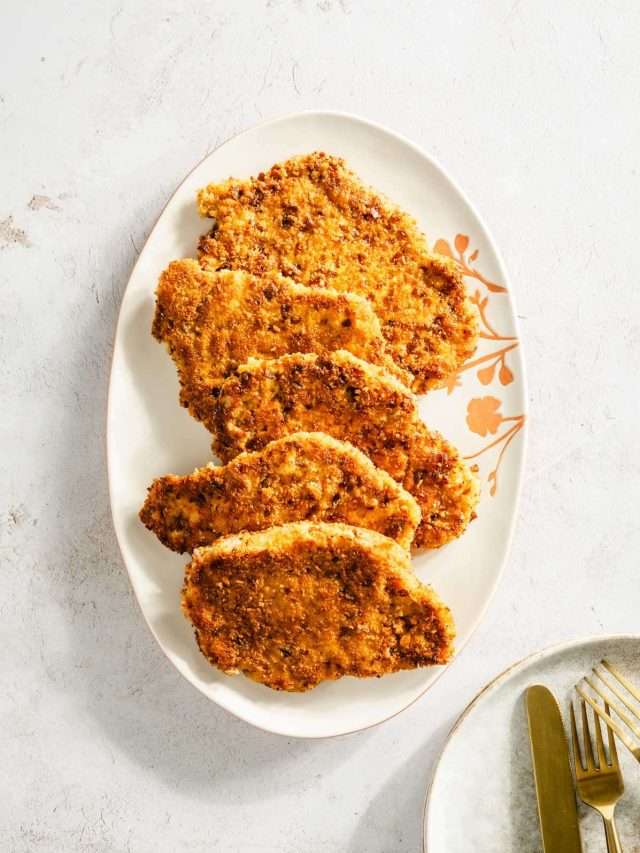 cooked pork chops on a serving plate