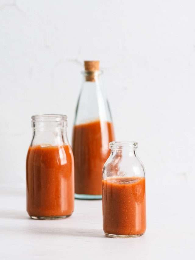 Peach BBQ Sauce in various bottles, straight on view