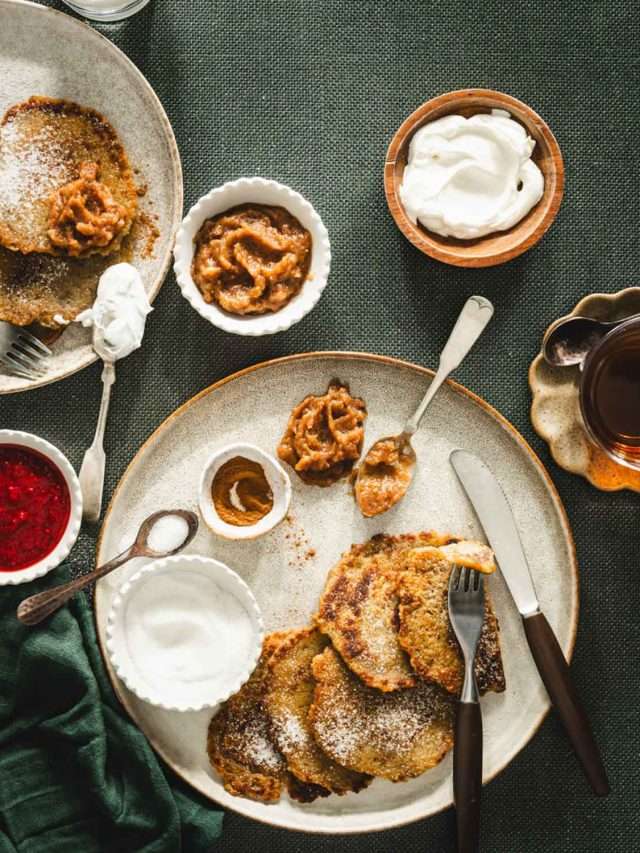 potatoes pancakes styled on a serving platter; small bowls and dishes with various garnishes