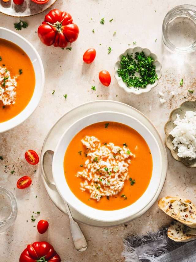 bowls with zupa pomidorowa, plate with rice, dish with parsley, cheesy toast