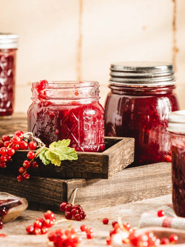 close up of a jar with red currant jam