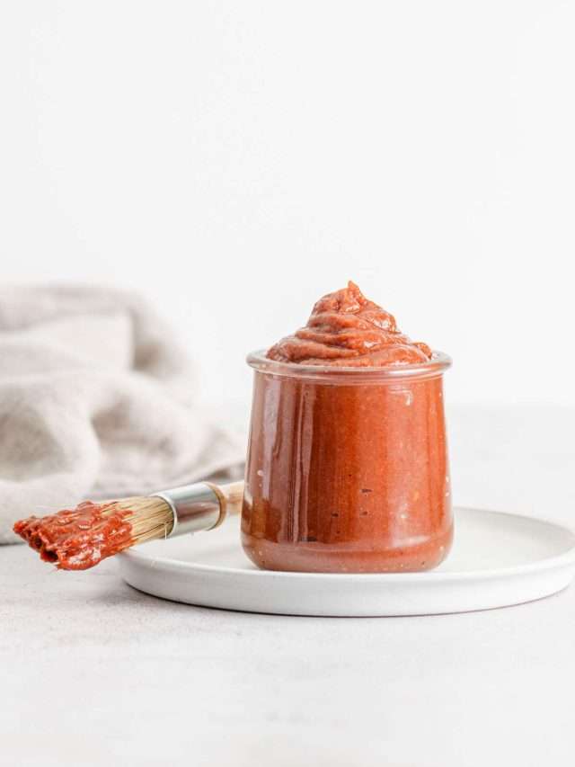 rhubarb BBQ sauce in a glass jar, front view